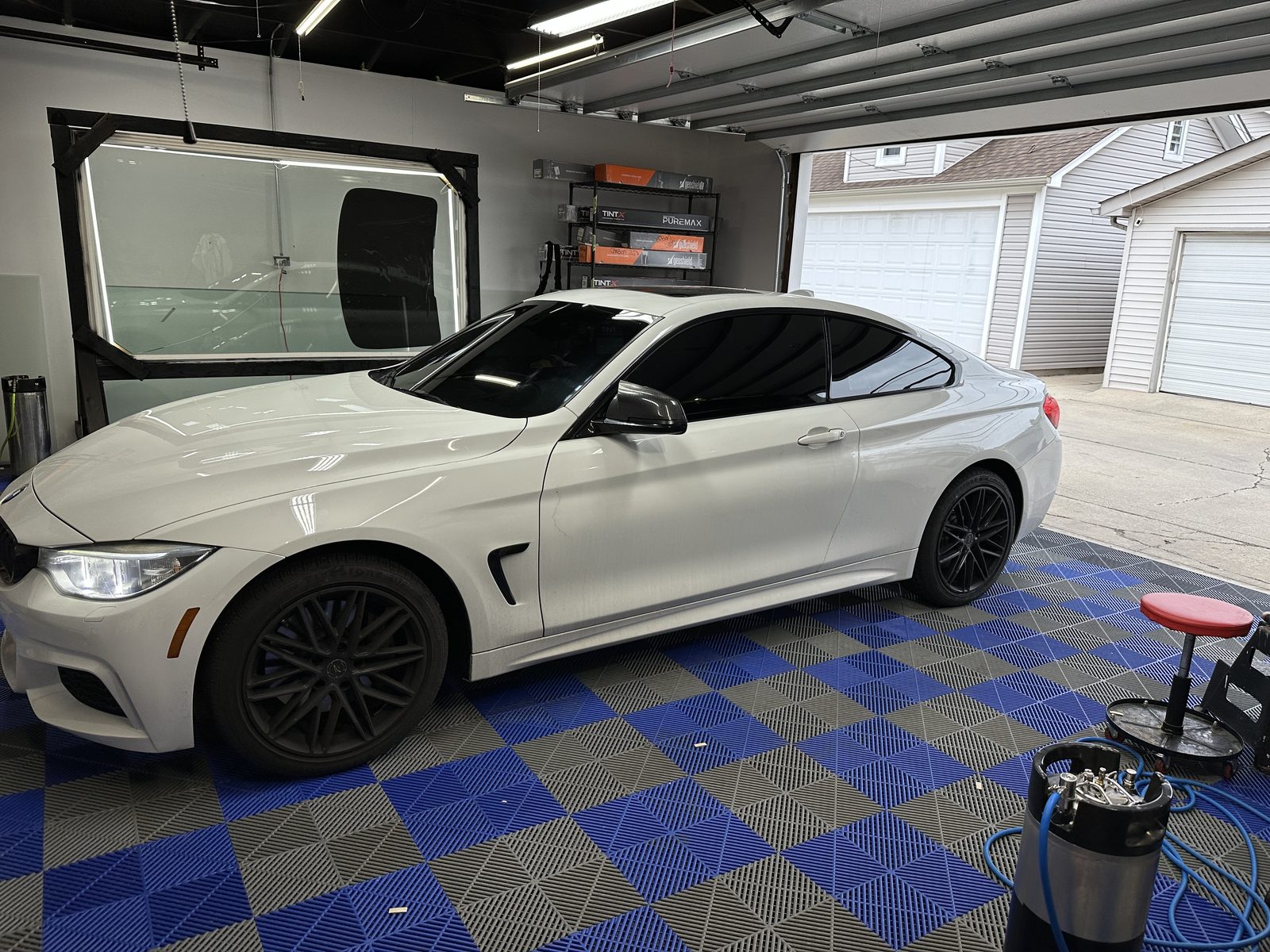 White BMW coupe with window tint