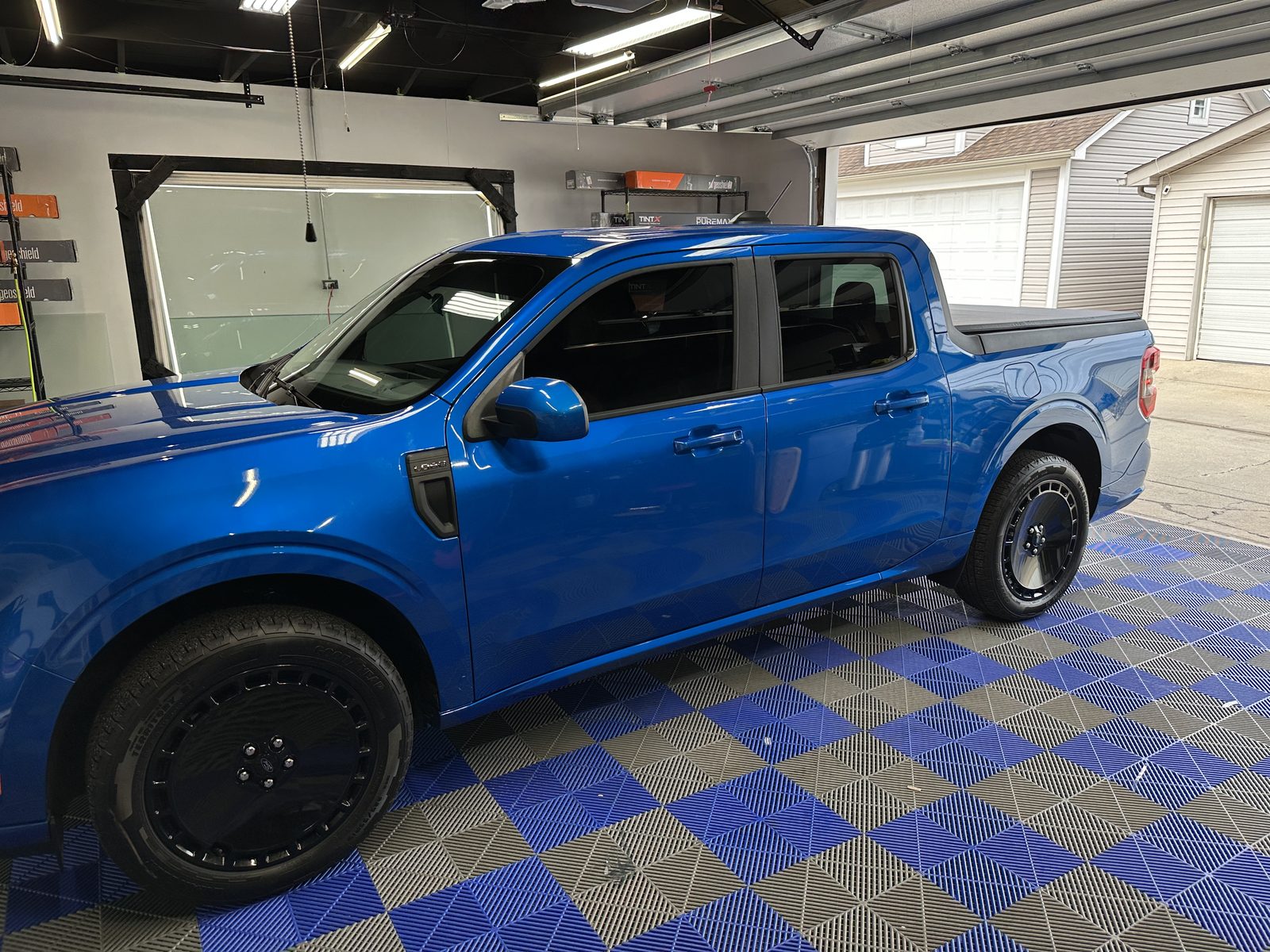Blue Ford Maverick with window tint