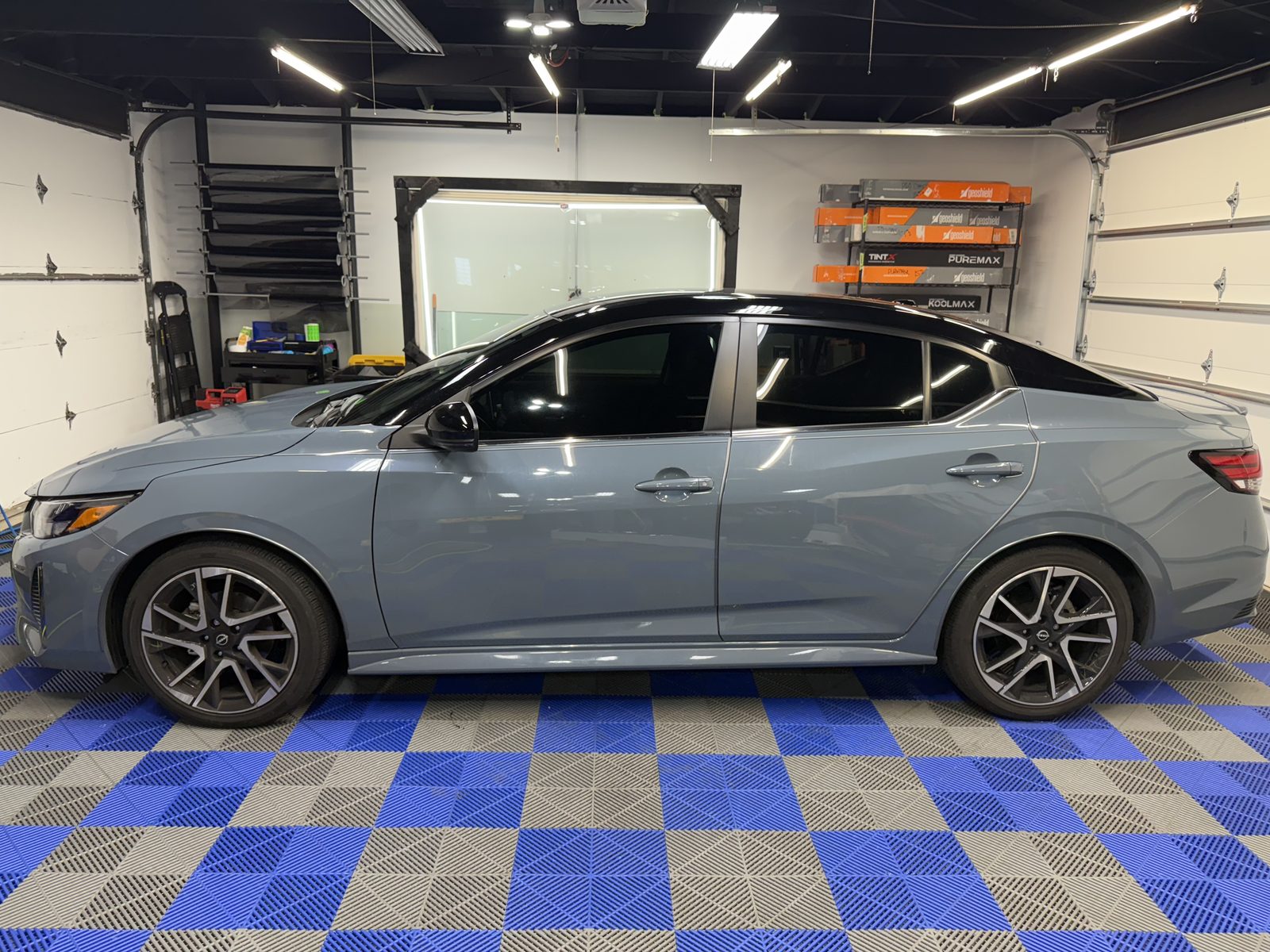 Gray Nissan Sentra SR side view tinted