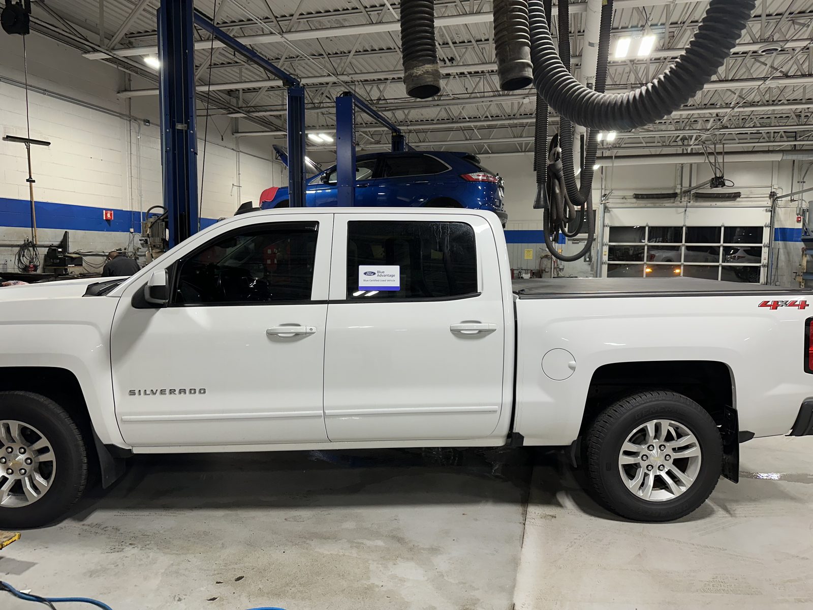 White Chevy Silverado with window tint