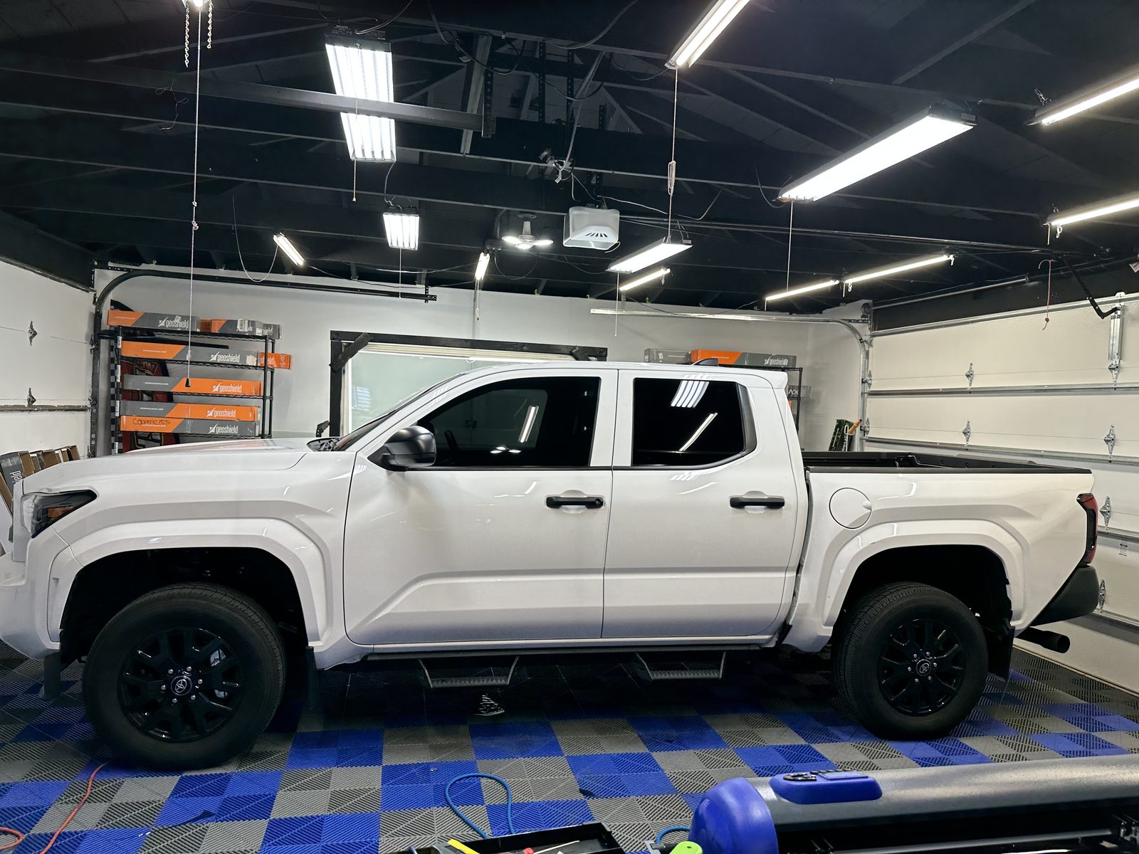 White Toyota Tacoma with tinted windows
