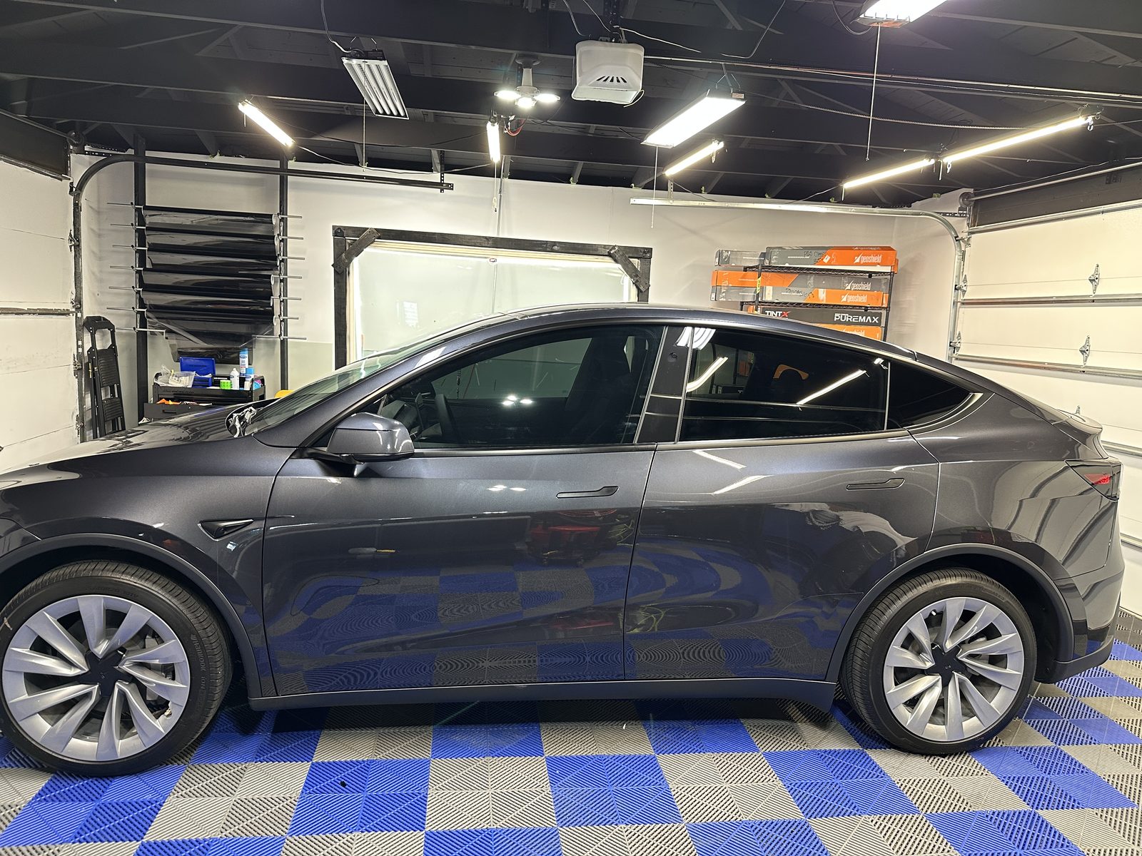 Gray Tesla Model Y with tinted windows